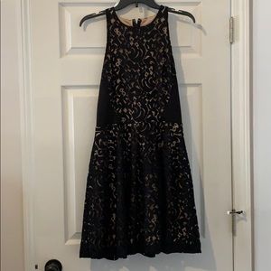 Black lace over nude dress